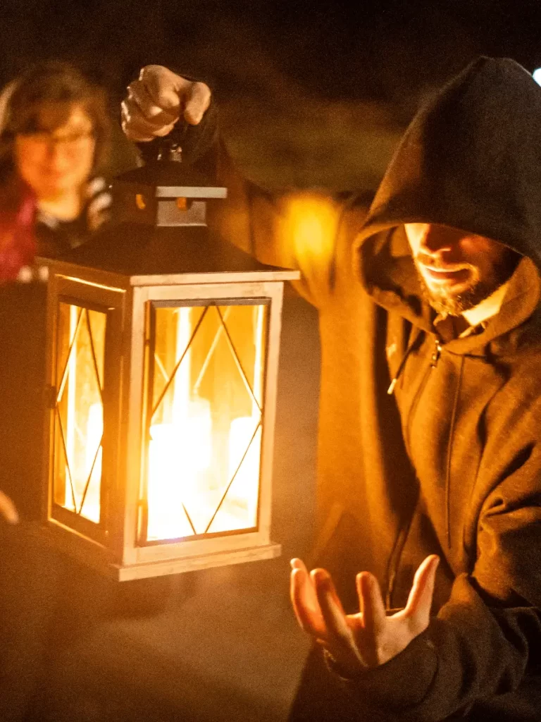 A man holding a lantern